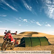 Simon and Lisa Thomas camped in their green Keron GT in sand dunes in India while riding near Jaislmer.