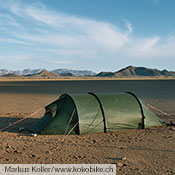 A Nammatj GT provides shelter in a Namibian desert.